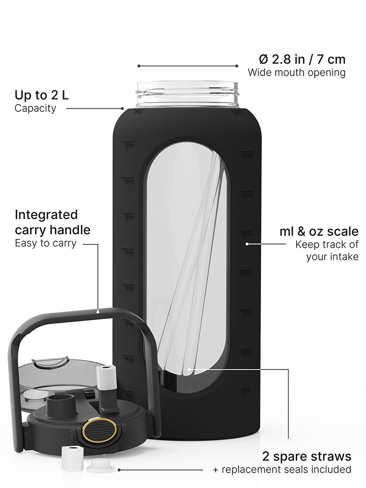 Black 2-liter glass water bottle with silicone sleeve, carry handle, straw lid, measurement scale, replacement seals and two spare straws.