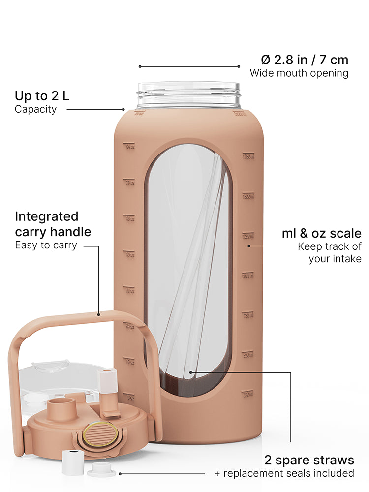 Brown 2-liter glass water bottle with silicone sleeve, carry handle, straw lid, measurement scale, replacement seals and two spare straws.